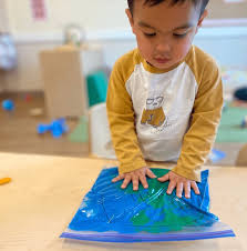 Child playing with sensory toy.